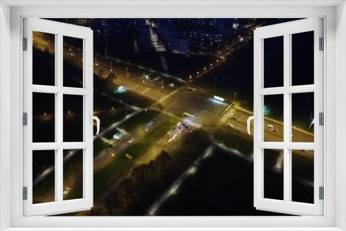 Fototapeta Naklejka Na Ścianę Okno 3D - Aerial view of the bustling city at night