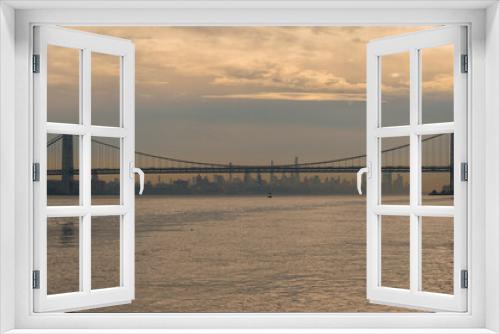 Fototapeta Naklejka Na Ścianę Okno 3D - A distance view of George Washington Bridge with Manhattan in the background  from the  Palisades Interstate Park in New Jersey
