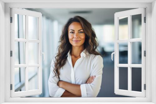 Smiling business woman looking at the camera.