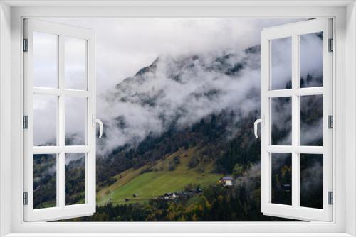 Fototapeta Naklejka Na Ścianę Okno 3D - mountain landscape in the austrian alps 
with clouds and fog