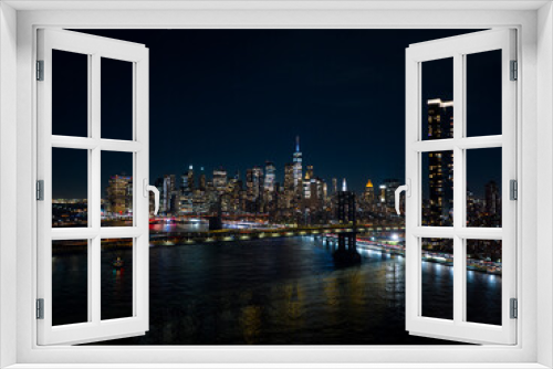 Fototapeta Naklejka Na Ścianę Okno 3D - Night aerials New York City. View of river and bridges lit