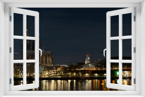 Fototapeta Naklejka Na Ścianę Okno 3D - a beautiful night view of cologne cathedral and the rhine river