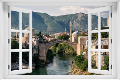 Fototapeta Naklejka Na Ścianę Okno 3D - the village and bridge in mostar, bosnia has one bridge spanning a mountain range