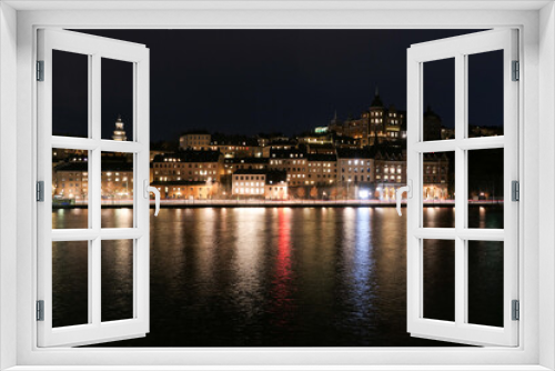 Fototapeta Naklejka Na Ścianę Okno 3D - View of illuminated buildings at night