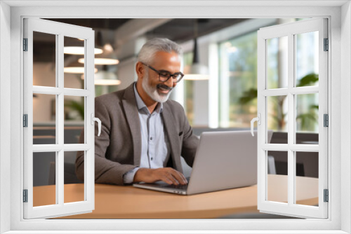 Indian Businessman at Work on Laptop