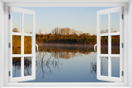 Fototapeta Naklejka Na Ścianę Okno 3D - Morning atmosphere with fog at the forest lake