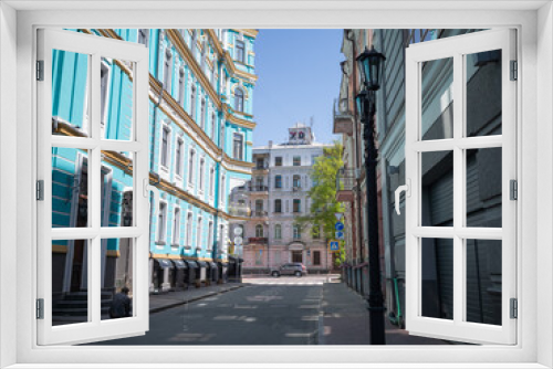 Fototapeta Naklejka Na Ścianę Okno 3D - historical emerald colored architectures and empty alleyway in capital kyiv
