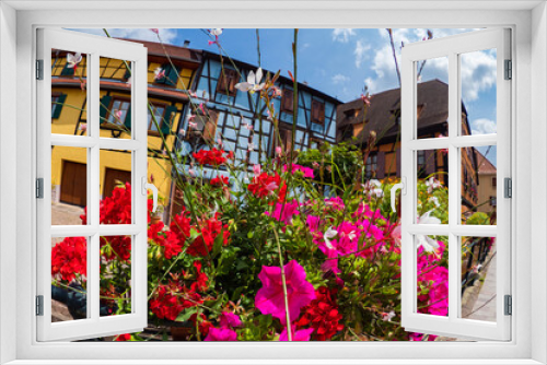 Fototapeta Naklejka Na Ścianę Okno 3D - the colorful half timbered building in the streets of the beautiful Alsace village Riquewihr
