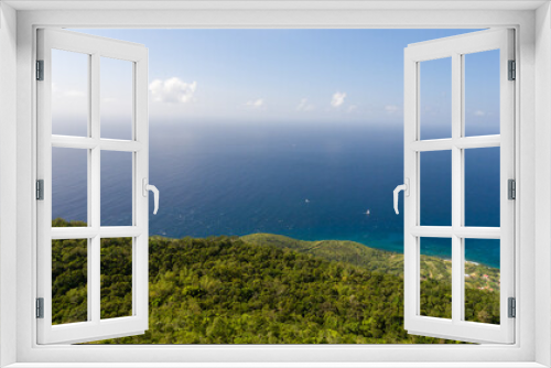 Fototapeta Naklejka Na Ścianę Okno 3D - Panoramic view of Martinique's verdant coast.