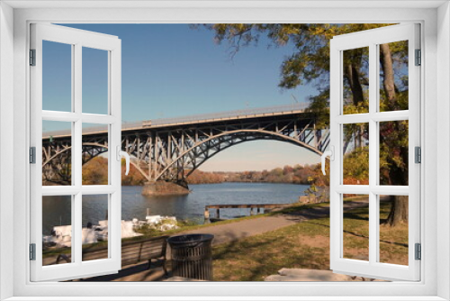Fototapeta Naklejka Na Ścianę Okno 3D - Arched Steel Bridge over Schuylkill River in Fall with Blue Sky