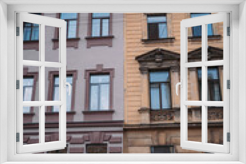 Fototapeta Naklejka Na Ścianę Okno 3D - Facades of ancient buildings. Brown and yellow buildings. Historical value. Architecture of Old Europe
