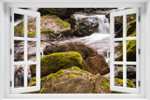 Fototapeta Naklejka Na Ścianę Okno 3D - Beautiful water stream in Gresso river Portugal. Long exposure smooth effect. Scenic landscape with beautiful mountain creek with green water among lush foliage in forest.