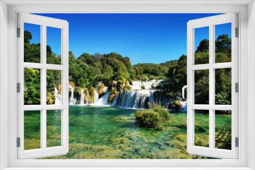 Fototapeta Naklejka Na Ścianę Okno 3D - Beautiful waterfalls surrounded by green vegetation in Krka National Park. Dalmatia, Croatia.
