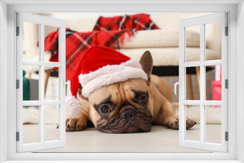 Fototapeta Naklejka Na Ścianę Okno 3D - Cute French bulldog in Santa hat at home on Christmas eve