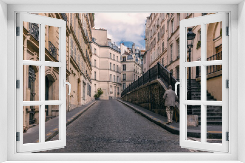Fototapeta Naklejka Na Ścianę Okno 3D - An old gentleman walking on a neighborhood in Montparnasse in Paris