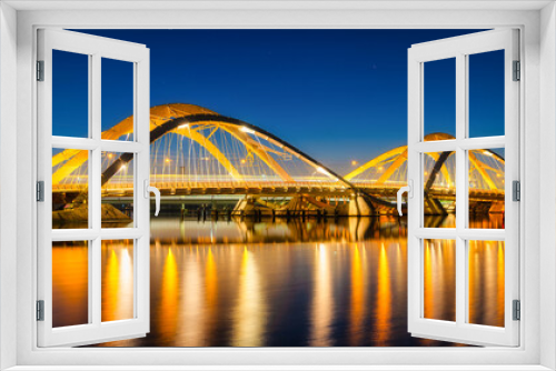 Fototapeta Naklejka Na Ścianę Okno 3D - A bridge in the city at night. The bridge against the sky during the blue hour. Architecture and design. Amsterdam, Netherlands. Panoramic photography for design and background..