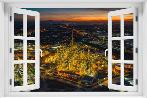 Fototapeta Naklejka Na Ścianę Okno 3D - Aerial view of the morning of the oil refinery from the drone of the tower of the Petrochemistry industry in the oil​ and​ gas​ ​industry with​ cloud​ sun orange​