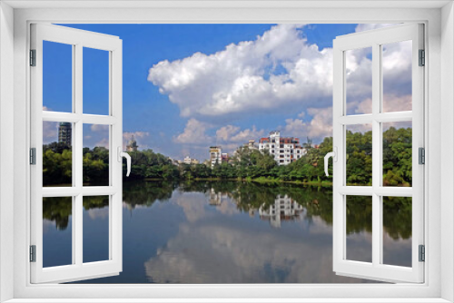 Fototapeta Naklejka Na Ścianę Okno 3D - Landscape view of a beautiful lake with a bridge in the bottanical garden dhaka bangladesh 