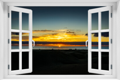 Fototapeta Naklejka Na Ścianę Okno 3D - Sunrise over the Atlantic Ocean. Shot from the Dunes of Maspalomas Gran Canaria