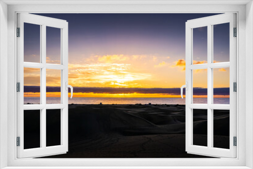 Fototapeta Naklejka Na Ścianę Okno 3D - Sunrise over the Atlantic Ocean. Shot from the Dunes of Maspalomas Gran Canaria