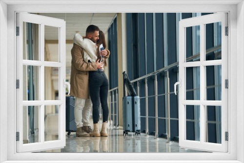 Farewell, embracing each other. Couple are in the airport hall together