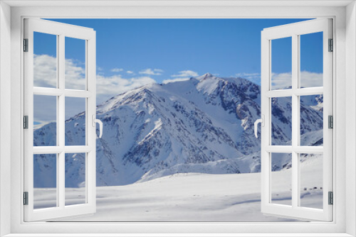 Fototapeta Naklejka Na Ścianę Okno 3D - Scenic view of a snow-covered mountain on a beautiful winter day. Andes mountain range, Chile.