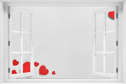Romantic composition with red paper hearts on white background. St. Valentine's Day.