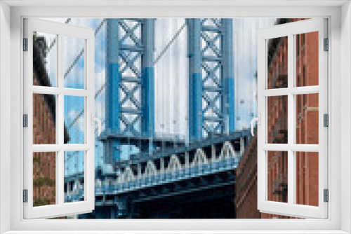 Fototapeta Naklejka Na Ścianę Okno 3D - Iconic view of Manhattan Bridge, New York City, USA seen from Washington Street in Dumbo (Down Under the Manhattan Bridge Overpass), Brooklyn with Empire State Building in background