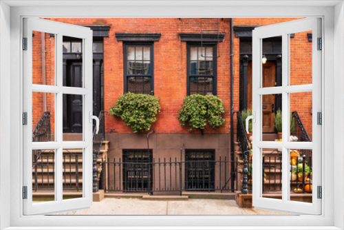 Fototapeta Naklejka Na Ścianę Okno 3D - Typical Greenwich Village houses in New York with entrance staircase and wooden doors