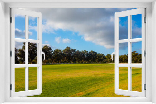 Fototapeta Naklejka Na Ścianę Okno 3D - Views of the Polo fields, mountains, coastal beach views, and eucalyptus trees in Will Rogers State Historic Park in the Pacific Palisades