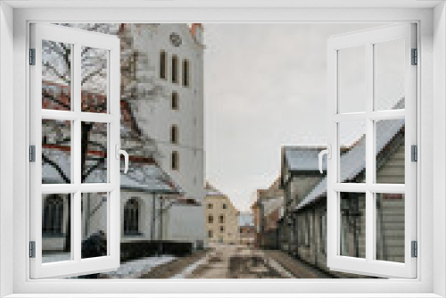 Fototapeta Naklejka Na Ścianę Okno 3D - Historic Religious Tower in Winter Town