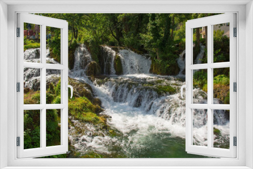 Fototapeta Naklejka Na Ścianę Okno 3D - A small waterfall in a stream which runs through the village of Martin Brod in Una-Sana Canton, Federation of Bosnia and Herzegovina. Located within the Una National Park. Early September