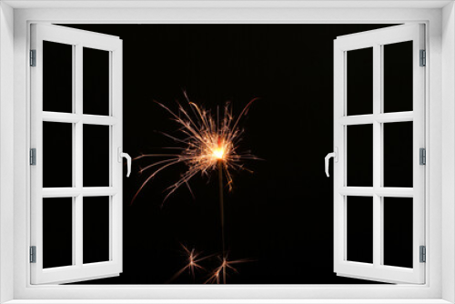 Fototapeta Naklejka Na Ścianę Okno 3D - Burning sparkler stick on black background, space for text