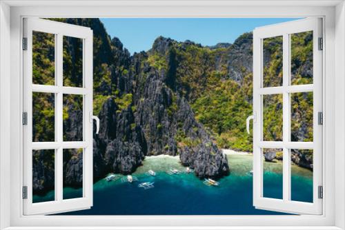 Fototapeta Naklejka Na Ścianę Okno 3D - Small lagoon in El nido. People walking on the white sand, with tropical jungle in the background. Concept about traveling and nature