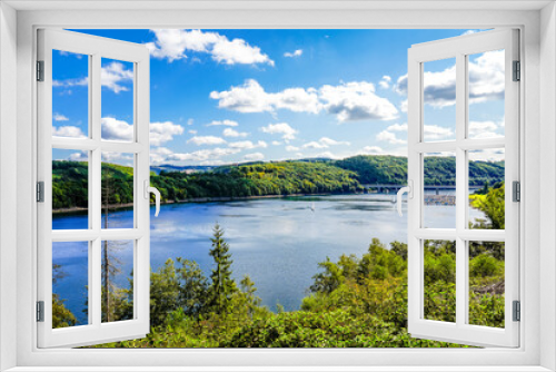 Fototapeta Naklejka Na Ścianę Okno 3D - View of the Biggesee near Attendorn in the Olpe district with the surrounding nature. Landscape by the lake in the Sauerland. Bigge Dam.
