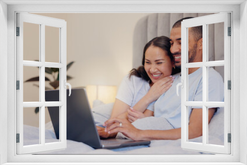 Laptop, happy and young couple in bed watching movie, film or show together at home. Smile, technology and man and woman relaxing in bedroom streaming a video on computer for bonding at modern house.