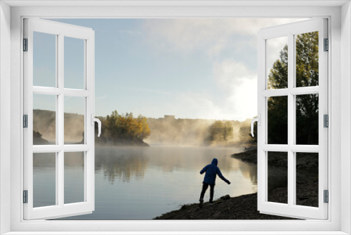 Fototapeta Naklejka Na Ścianę Okno 3D - silhouette in front of a misty lake