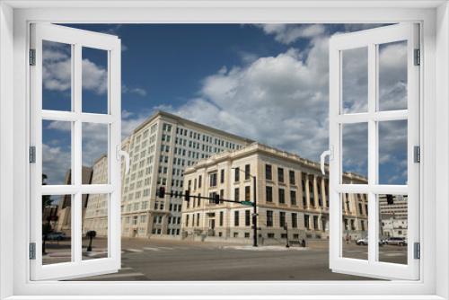 Fototapeta Naklejka Na Ścianę Okno 3D - Topeka, Kansas, USA - June 17, 2023: Afternoon light shines on historic buildings in downtown Topeka.