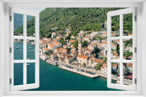 Fototapeta Naklejka Na Ścianę Okno 3D - Aerial view of the ancient bell tower of the Church of St. Nicholas among the red roofs of houses. Perast, Montenegro