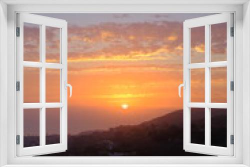 Fototapeta Naklejka Na Ścianę Okno 3D - bright sunset over the ocean and mountains