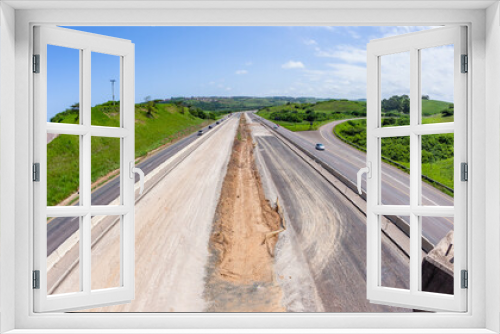Fototapeta Naklejka Na Ścianę Okno 3D - Driving Road Highway New Construction Expansion Of Vehicle Lanes Overhead Landscape Photograph.