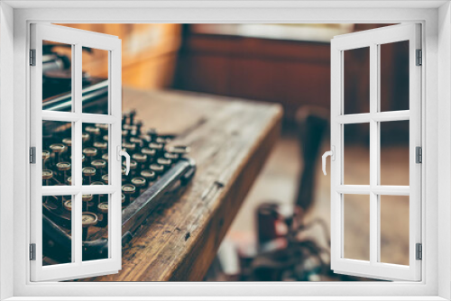 An old typewriter is placed on the left side, a beautiful picture, an interior decoration, a background image