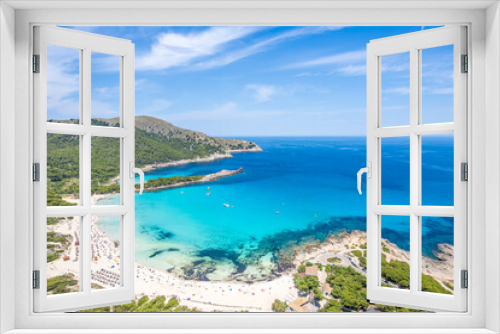Fototapeta Naklejka Na Ścianę Okno 3D - Aerial view of Cala Agulla and beautiful coast at Cala Ratjada, Mallorca: pristine beach, crystal waters, surrounded by nature, perfect Mediterranean escape.