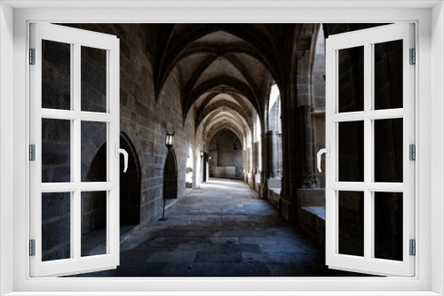 Fototapeta Naklejka Na Ścianę Okno 3D - Interior corridor in ancient landmark building with gothic arch in a medieval architecture in Narbonne, France
