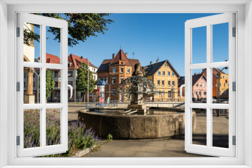 Fototapeta Naklejka Na Ścianę Okno 3D - Biberbrunnen mit Gebäudeensemble beim Rathaus von Stuttgart Feuerbach