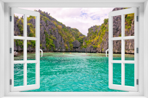 Fototapeta Naklejka Na Ścianę Okno 3D - PALAWAN, PHILIPPINES - DECEMBER 21, 2023: Blue lagoon tropical landscape at the Coron island bay in Palawan province Philippines. 6 million foreign tourists visited Philippines in 2016.
