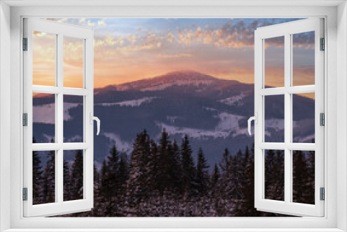 Fototapeta Naklejka Na Ścianę Okno 3D - Winter sunset alpine top  view from mountain village and fir forest in front. Picturesque seasonal, nature and countryside beauty concept scene.