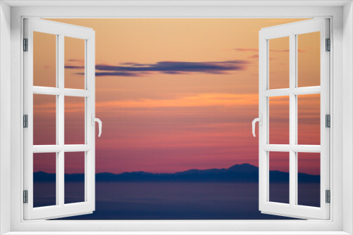 Fototapeta Naklejka Na Ścianę Okno 3D - Mountain silhouette at sundown