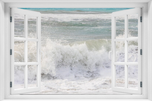 Fototapeta Naklejka Na Ścianę Okno 3D - The sea in blue and green colors with crashing waves on a stormy day in Agios Georgios on the island of Corfu