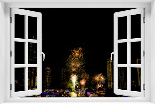 Fototapeta Naklejka Na Ścianę Okno 3D - Firework show to celebrate of the new year 2024 along Chao Praya River with the night scene on Asiatique landmark side in Bangkok city, Thailand.
